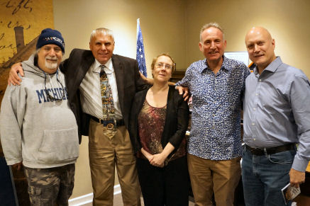 Colaborators pose for photo